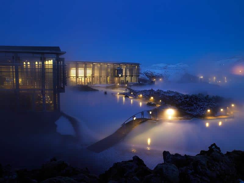 Blue Lagoon in Iceland at night wit stem rising from the water